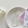 Minimalist phone lanyard with white pearls, clear beads, and a cute bear charm pendant - Pearl Crystal Bear Bracelet