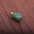 Detailed view of a green faceted aventurine perfume bottle pendant on a gold necklace - Green Aventurine Perfume Bottle (Gold Chain)