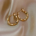 Detailed close-up of golden geometric hoop earrings on elegant silk fabric background - Metal Cube Hoops-Gold