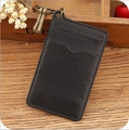 Retro black leather card holder with bronze key ring on vintage wooden background - Black