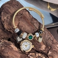 Adjustable golden bracelet watch with crystal beads and a heart floral pendant - Gold Green Gemstone Bangle