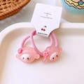 Detail of two pink elastic hair ties with cute translucent resin animal charms on a card - Pink Lamb Style