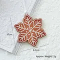 Brown wooden snowflake ornament with white patterns and a hanging string, 10cm x 8.5cm size - 10cm Snowflake B