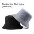 Reversible cotton bucket hat in black and grey-blue showing both sides with stitch detail - Blue Outside Black Inside (Reversible)