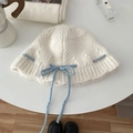 White knitted bucket hat with blue ribbon tie, minimalist winter headwear accessory - Hat / Off White