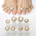 Close-up of 10-piece gold and silver toe ring set with champagne and clear gemstones - Gold/Silver Base Champagne Gem (Set of 10)