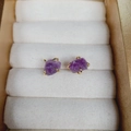Elegant four-prong purple raw amethyst stud earrings with gold finish on velvet box - Amethyst