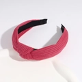 Rose pink knotted wide headband with textured knit fabric on a stylish display - Dark Red