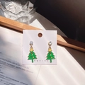 Macro detail of Christmas tree earrings with green enamel, gold base and shiny rhinestones - Christmas Tree B