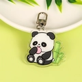 Cute acrylic panda keychain with green bamboo accessory on white display plate - Panda Keychain (Eating Bamboo)
