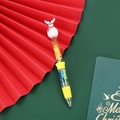 Yellow Christmas ballpoint pen with white reindeer topper and liquid glitter sand - Series 1 - Snowman