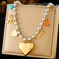 Detail of layered necklace featuring gold heart, bow, and cross charms on silver bead chain - Large Heart/Bow/Cross/DIOS Style (N3251)