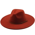 Detail of red-brown wide brim fedora hat with brown leather buckle and wool finish - Caramel color