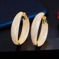 Luxurious gold oval hoop earrings with shimmering pavé set cubic zirconia for women - Gold