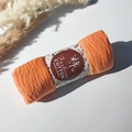 Orange pleated cotton viscose scarf roll with floral paper wrap and bubble texture - Style #87