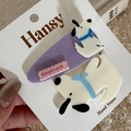 Close-up of cute cartoon dog hair clips set on brand card with purple and white resin detail - 2-Pack Cartoon - Purple Dog