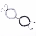 Macro shot of black and white turquoise bead bracelets with heart-shaped magnetic clasp - White Turquoise and Matte Stone