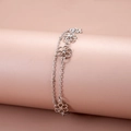Detail of silver double-layered chain bracelet with hollow floral charms and zircon - Silver Double Layer Hollow Floral Style (0657)