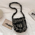 Flat lay of leopard print plush bucket bag with bohemian paisley pattern and magazine - Ethnic Style Totem