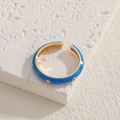Adjustable gold-plated ring with blue enamel and polka dots on a textured base - Blue
