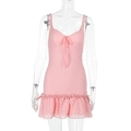 Detail of pink knitted mini dress featuring wavy texture fabric and ruffled hemline - S / Pink