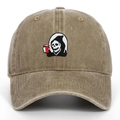 Close-up of Grim Reaper embroidery on vintage khaki washed cotton baseball cap - Khaki