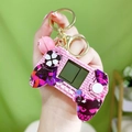 Pink graffiti game controller keychain with mini screen, buttons and a golden bell - Marvel Game Console - Pink