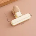 Small beige plastic food sealer clip with metal spring for airtight snack bag storage - Beige White Small