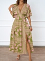 Detail of deep V-neckline and waist-cinching floral print design on a summer dress - S / Green and Pink Print