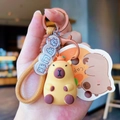 Cute Capybara plush keychain with woven strap and charm for bags or car keys - Capy Sect Forever