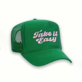 Detail of green trucker hat with Take It Easy pink embroidery and breathable mesh back - One Size / Green/Pink Logo
