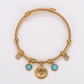 Pulsera de cable de acero inoxidable dorado con colgante de corazón y turquesas azules - Dorado