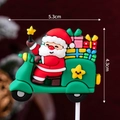 Santa Claus on green motorcycle cake topper, 5.3x4.3cm silicone Christmas decoration - Soft Rubber Santa on Green Scooter