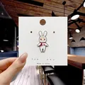 Cute cartoon white rabbit enamel pin with red scarf accessory on display card - 109*Cute Rabbit with Scarf Pin