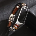 Close-up of vintage leather strap with woven details and silver metal frame for smart band - Gen 3-4: Orange Leather + Silver Frame