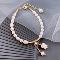 Elegant freshwater pearl bracelet with lily of the valley pendant and golden lobster clasp - Freshwater Pearl White Rose Bracelet