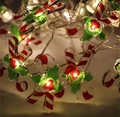 Christmas LED string lights featuring red candy canes and holly leaves with warm glow - 1m 10-LED (2AA Battery Model) / Crossed Candy Canes