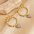 Two-tone 18K gold plated stainless steel heart earrings on silk background - Gold Spiked Ring with Silver Heart Earrings