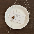 Macro detail of natural brown tiger eye stone pendant on sleek silver snake chain necklace - 35# Necklace - Silver - Brown
