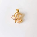 Detailed view of an 18k gold butterfly pendant with sparkling crystal inlay on wings - Cat Eye Diamond Butterfly*Gold