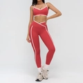 Two-piece brick red yoga set with white contrast trim and crossover V-waist leggings - S / V-Neck Strappy Bra & Leggings Set / Raspberry Red