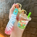 Portachiavi bubble tea con cinturino sfumato rosa-blu e perle di sabbia mobile liquida - Verde