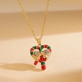 Christmas heart necklace with candy cane design and golden bow pendant on a gold chain - Christmas Heart Candy / Gold