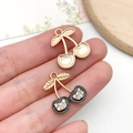 Luxurious cherry charm pendant with black enamel finish and white rhinestones - KC Gold Black White Rhinestone Cherry (23404)