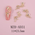 Macro view of gold alloy hollow star nail charms with wave chain details for DIY manicure - Gold Star Chain (AD31)