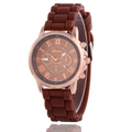 Detail showing Geneva watch with rose gold case, brown dial, and Roman numerals - Coffee
