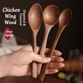 Three-piece set of wenge wood spoons with long handles and natural wood grain finish - 3-Piece Family Wood Spoon Set