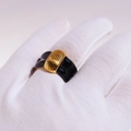 Bold black and gold enamel ridge ring with vintage aesthetic on a gloved hand - US 8 / Black