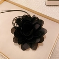 Elegant black fabric camellia choker necklace with long ribbon ties on leather tray - 21# Black Camellia Style Tie Choker