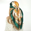 Green and beige satin headscarf with vintage paisley floral print shown on back of head - Dark Green Paisley